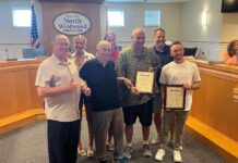 Anglers Save Drowning Man After Motorboat Flips Kayak Men receiving an award