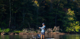 Old Dog Learns New Trick: The True Story young man stands and fishes with a jerkbait from a kayak