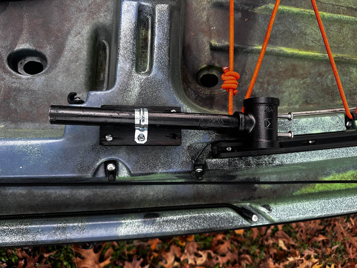 overhead view of the DIY base for the outrigger bar after being affixed to the kayak hull