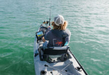 Gear Of The Year: Best Stuff For Offshore Fishing person offshore kayak fishing with gear including Lowrance fish finder
