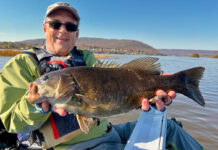 Take Your River Fishing To The Next Level Jeff Little poses with a smallmouth bass caught while kayak fishing on a river