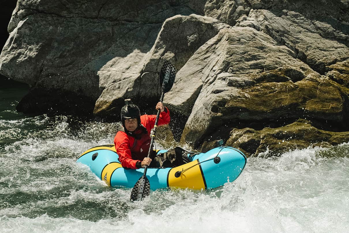 Yak Van Dam paddles whitewater in a packraft