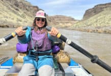 The Basics Of Rafting A rafter rowing an oar rig down a canyon.