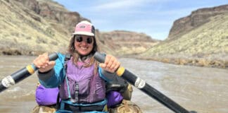 The Basics Of Rafting A rafter rowing an oar rig down a canyon.