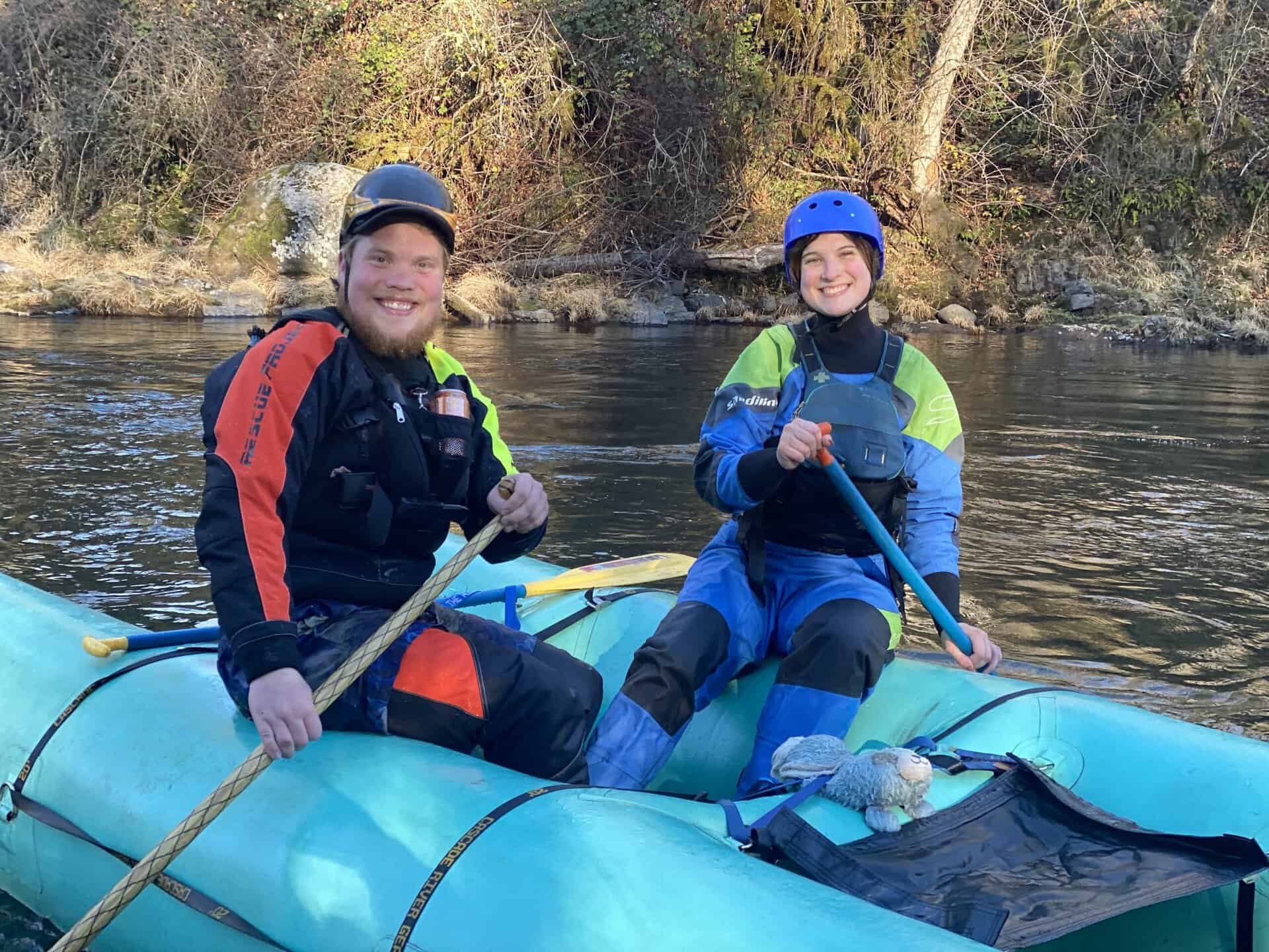 A two-person rafting team on a paddlecat.