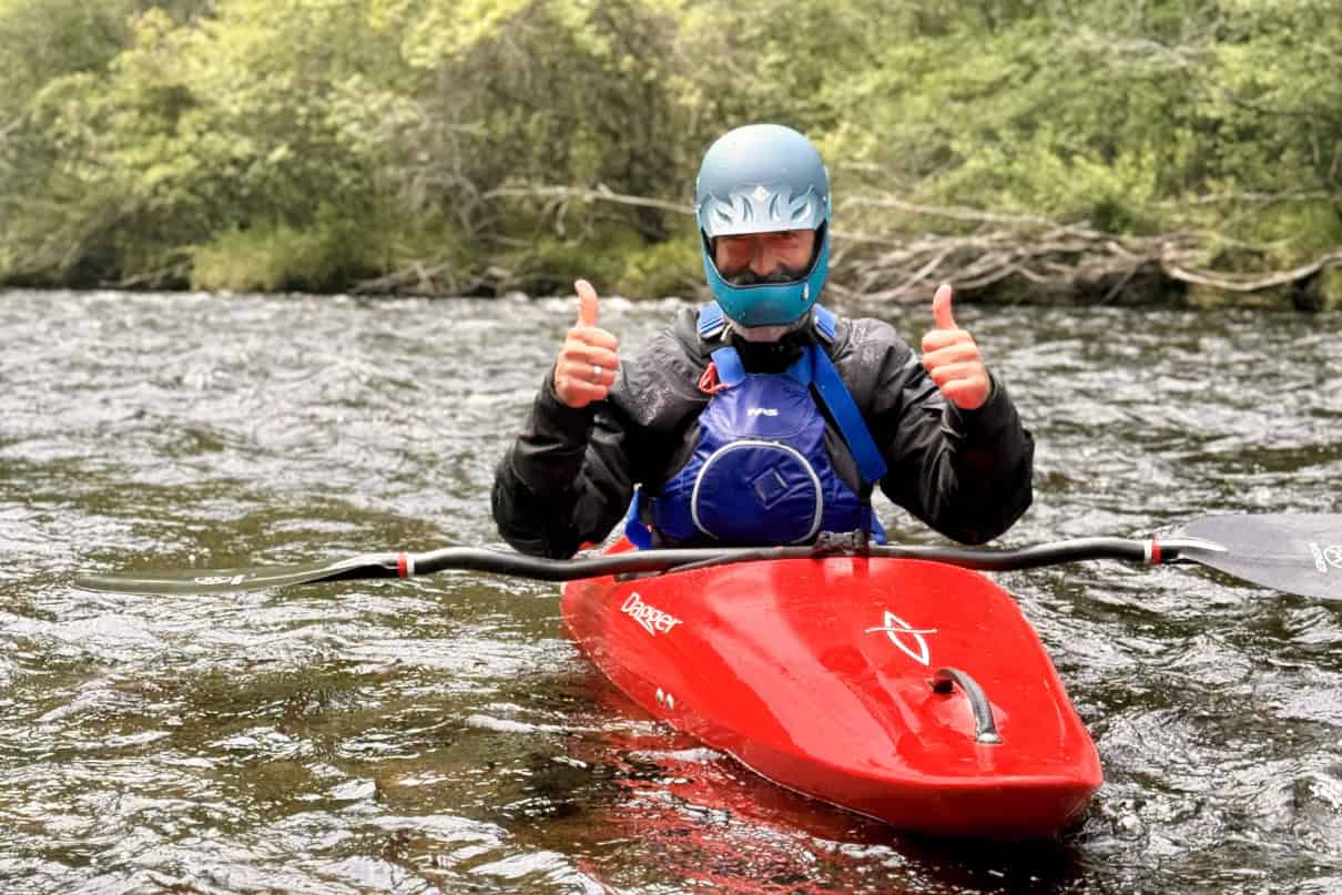 A kayaker wearing a drysuit.