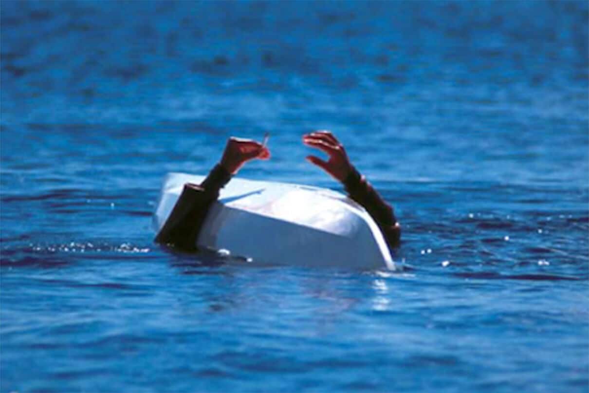 A paddler demonstrates the traditional hunting technique called “rolling the kayak without submerging one's cigarette”